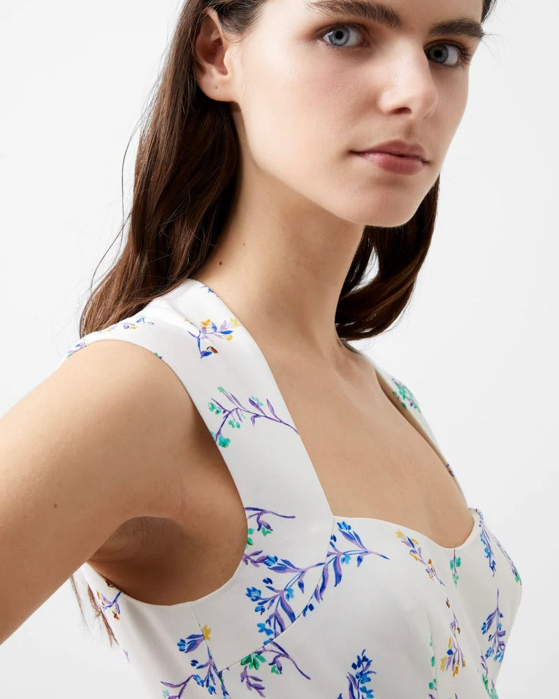 Model Wearing French Connection Floriana Sweetheart Dress on a white background