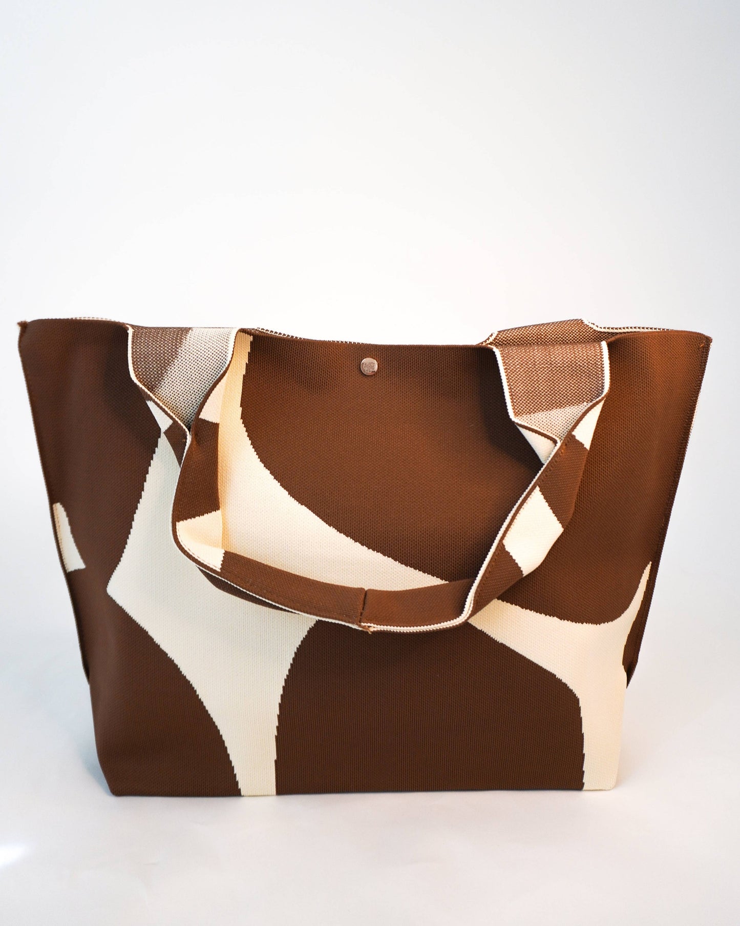 Brown and beige tote bag on a white background