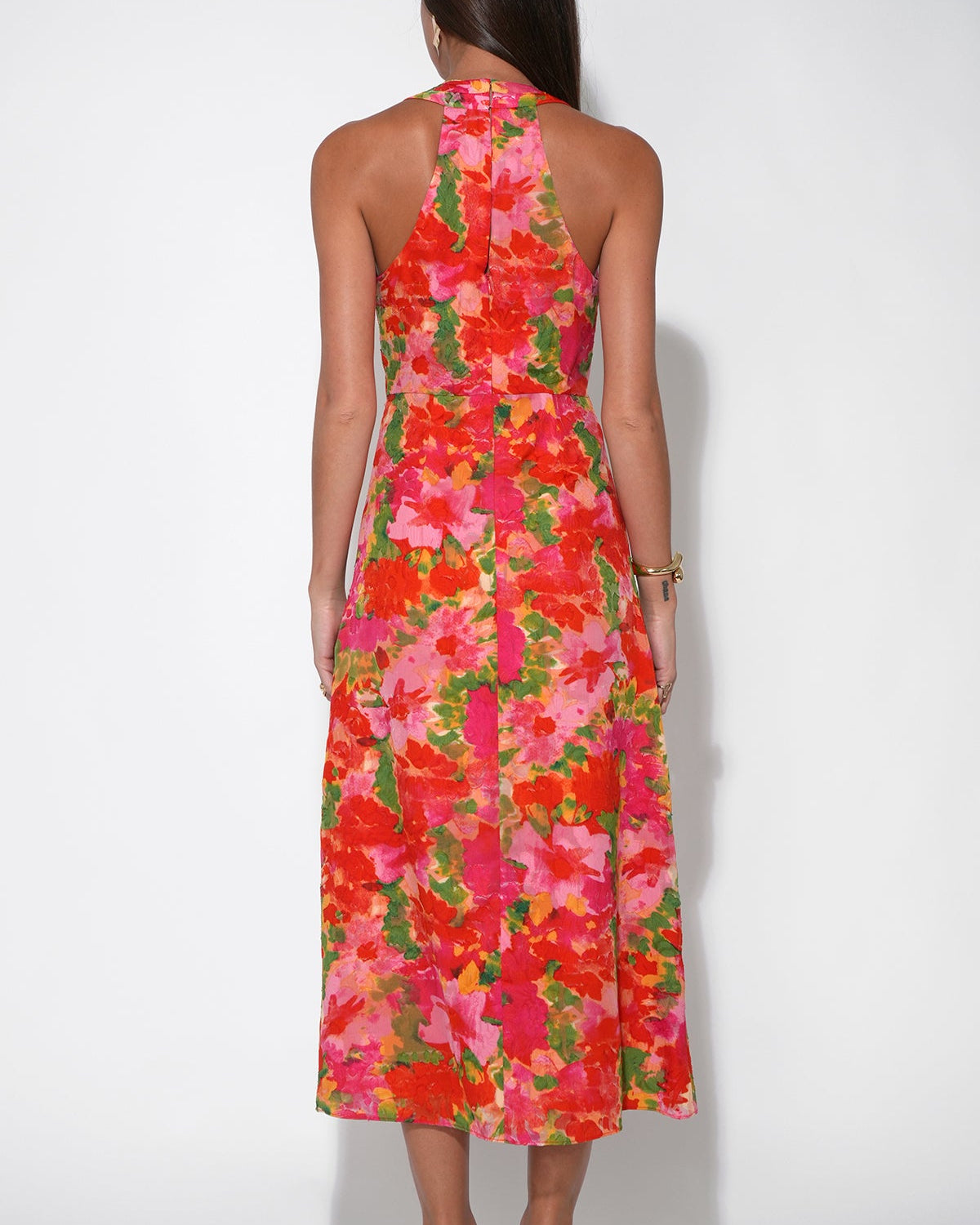 Back view of the Hatrina Halter Midi Dress with Rosette in front of a white background.