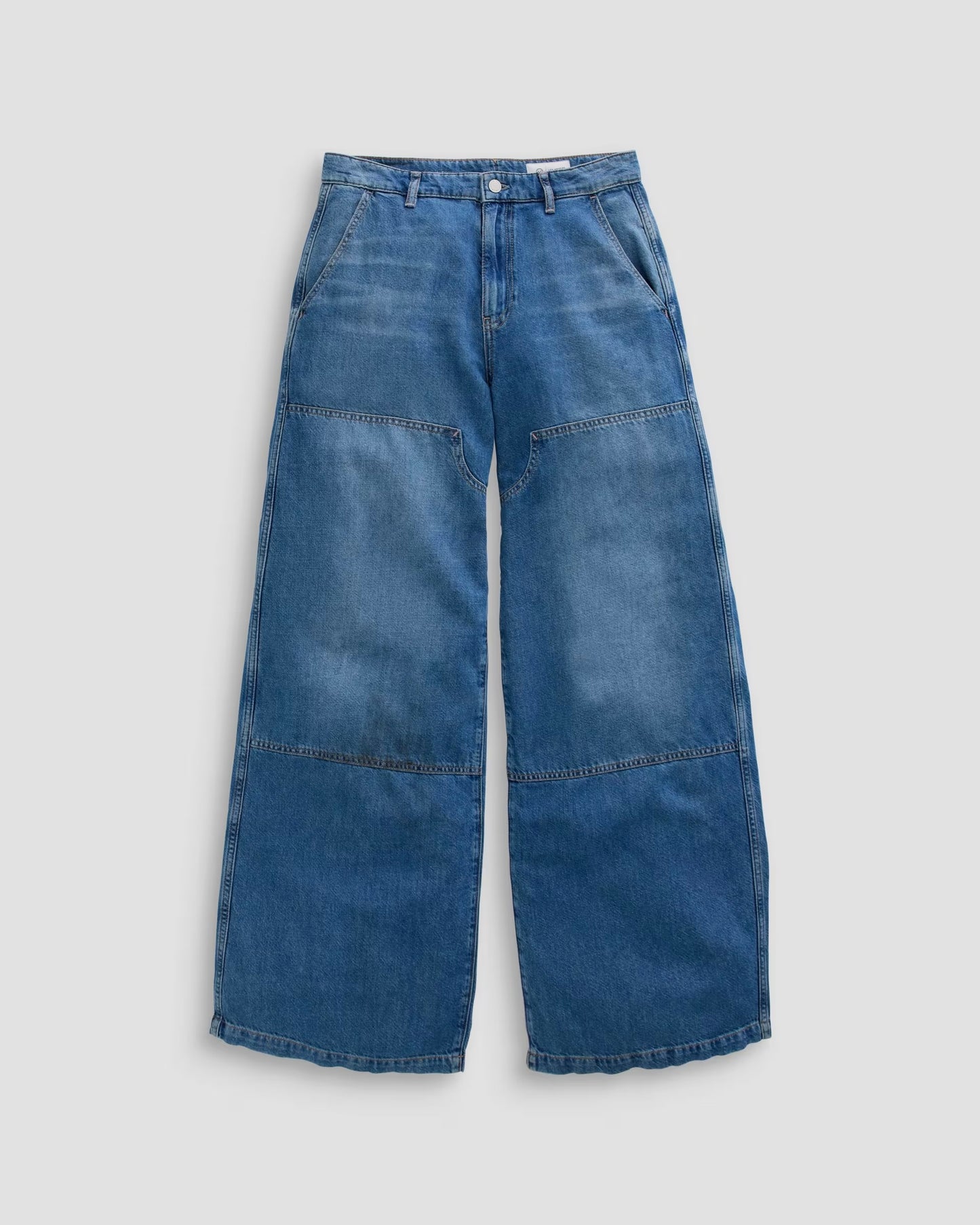 Blue jeans on a light gray background