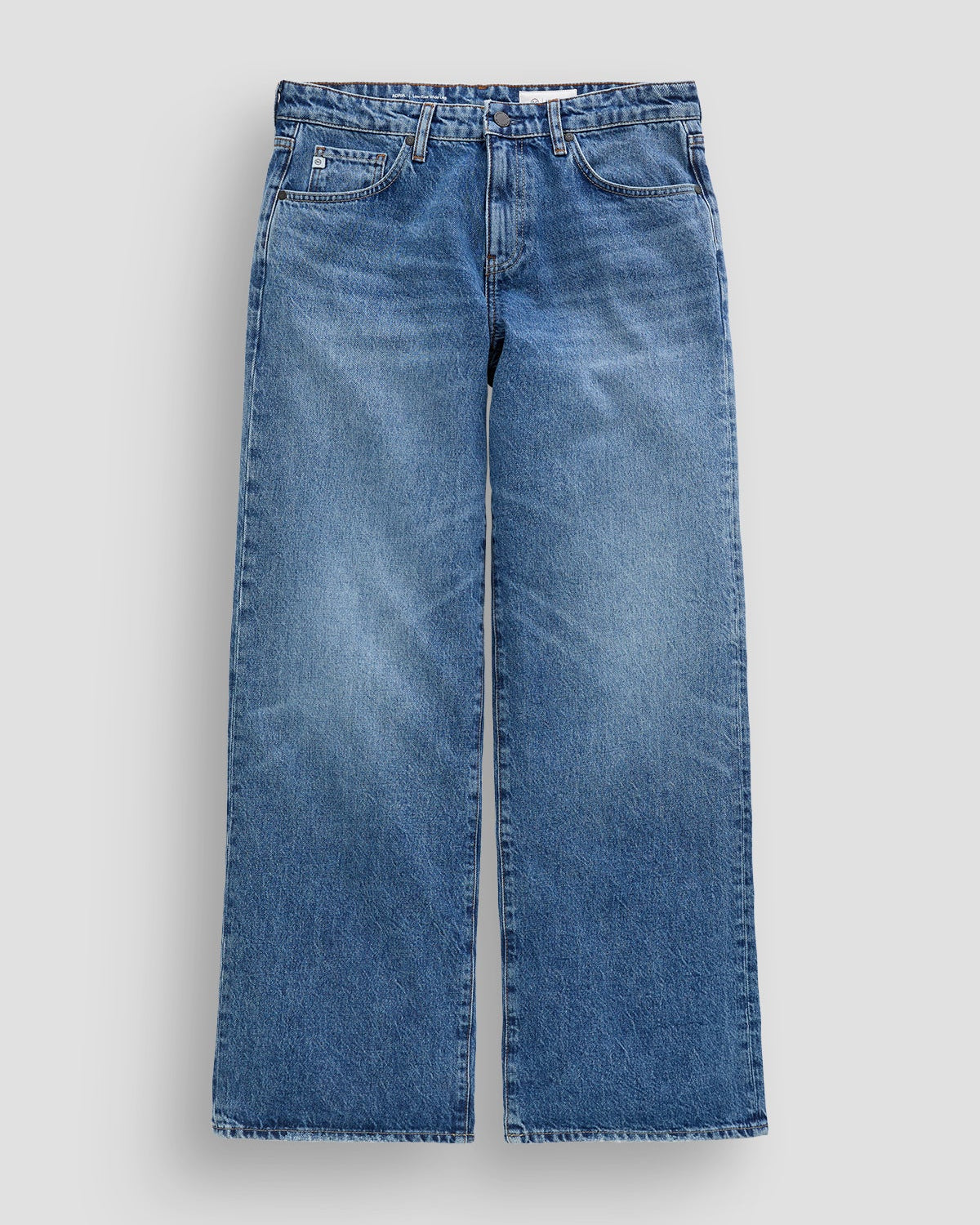 Pair of blue jeans on a light gray background