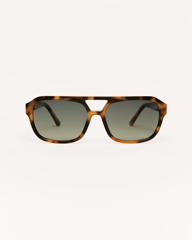 Sunglasses with tortoiseshell frame and dark lenses on a white background