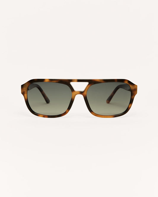 Sunglasses with tortoiseshell frame and dark lenses on a white background
