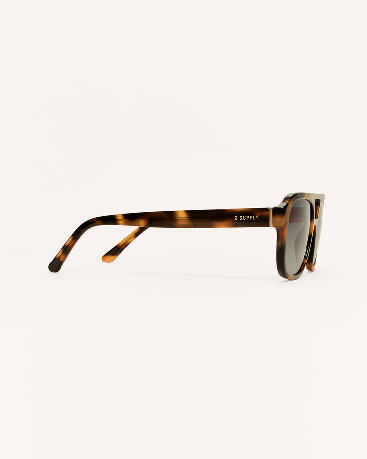 Sunglasses with tortoiseshell frame on a white background