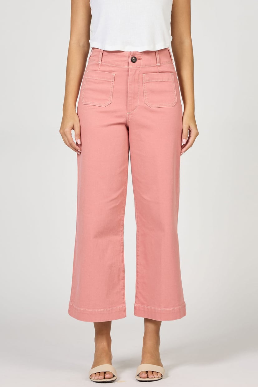 Person wearing pink pants on a white background