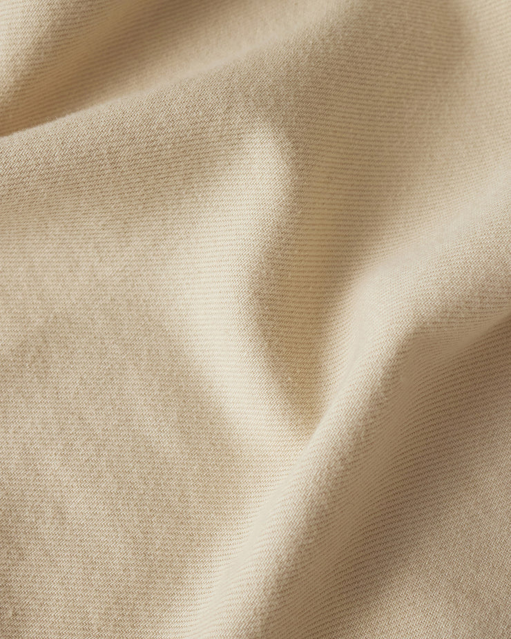 Close-up of beige fabric with folds