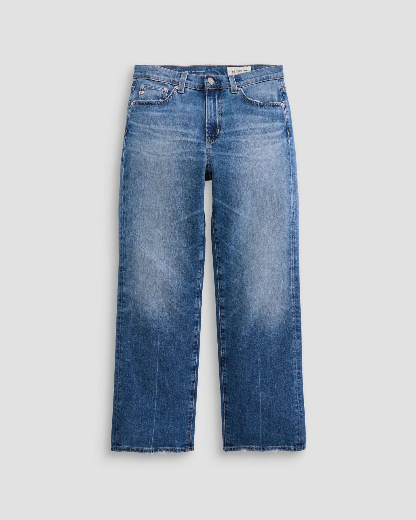 Blue jeans on a light gray background