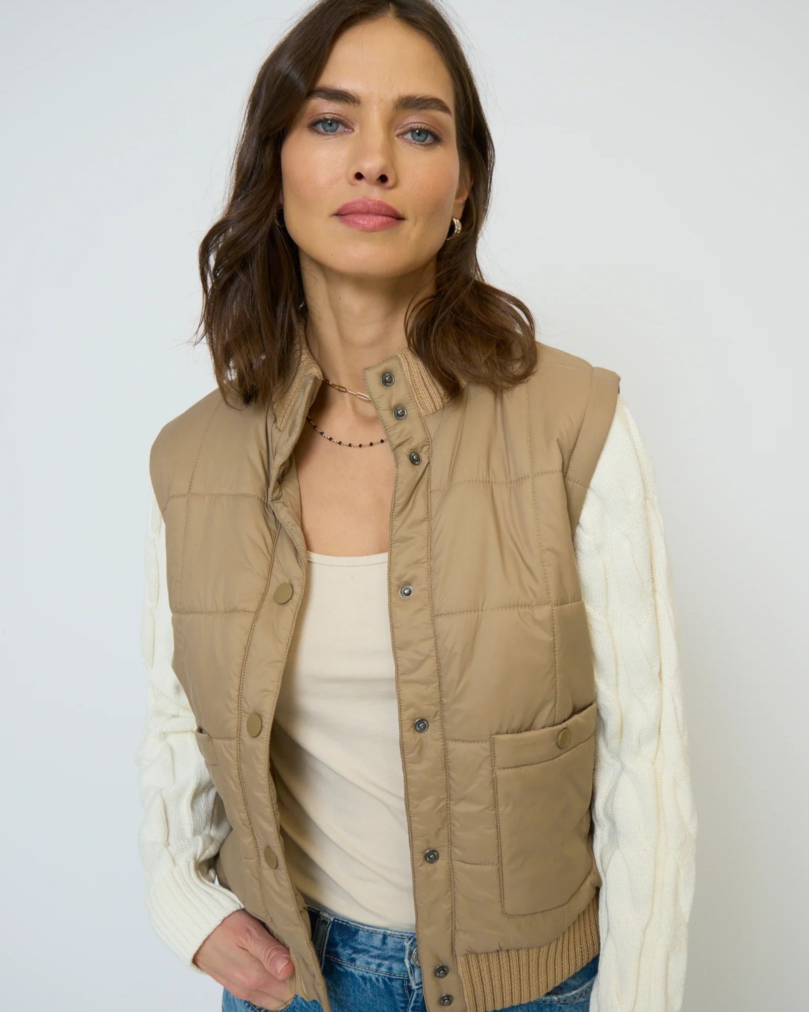 Model is wearing Central Park West Brady Quilted Mixed Media Jacket in Oat on a white background