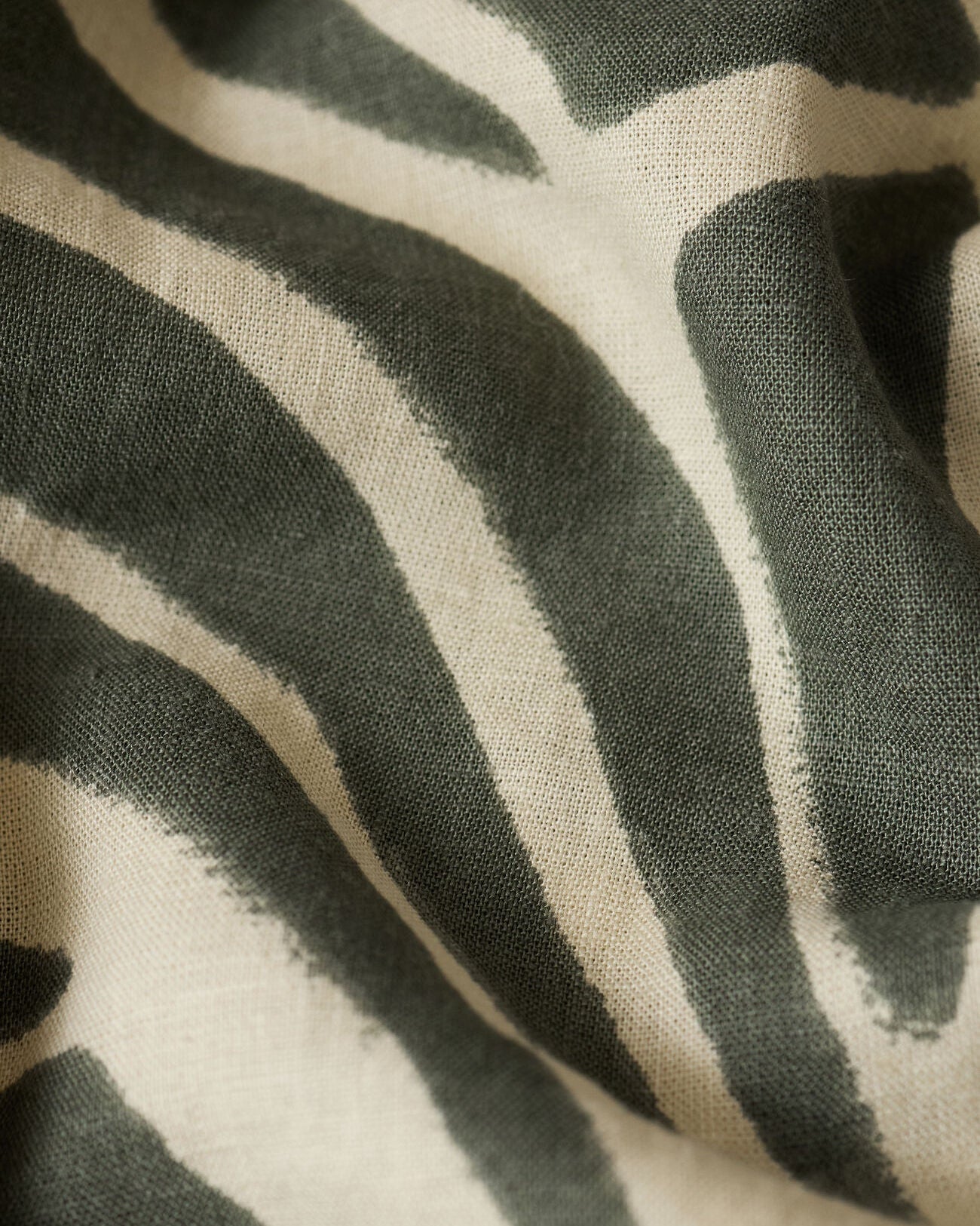 Close-up of fabric with black and white abstract pattern