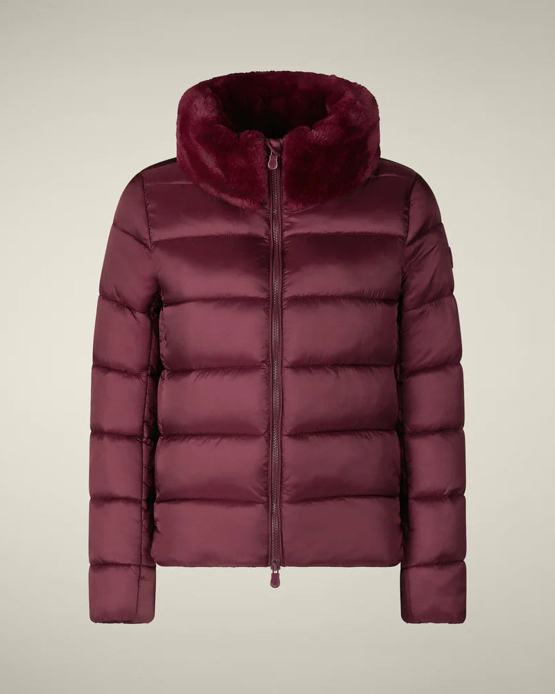 Maroon puffer jacket with fur-lined hood on a beige background