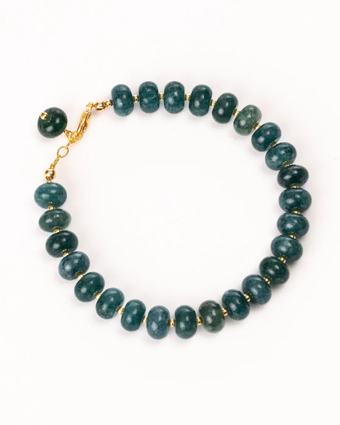 Beaded bracelet with gold clasp on a white background