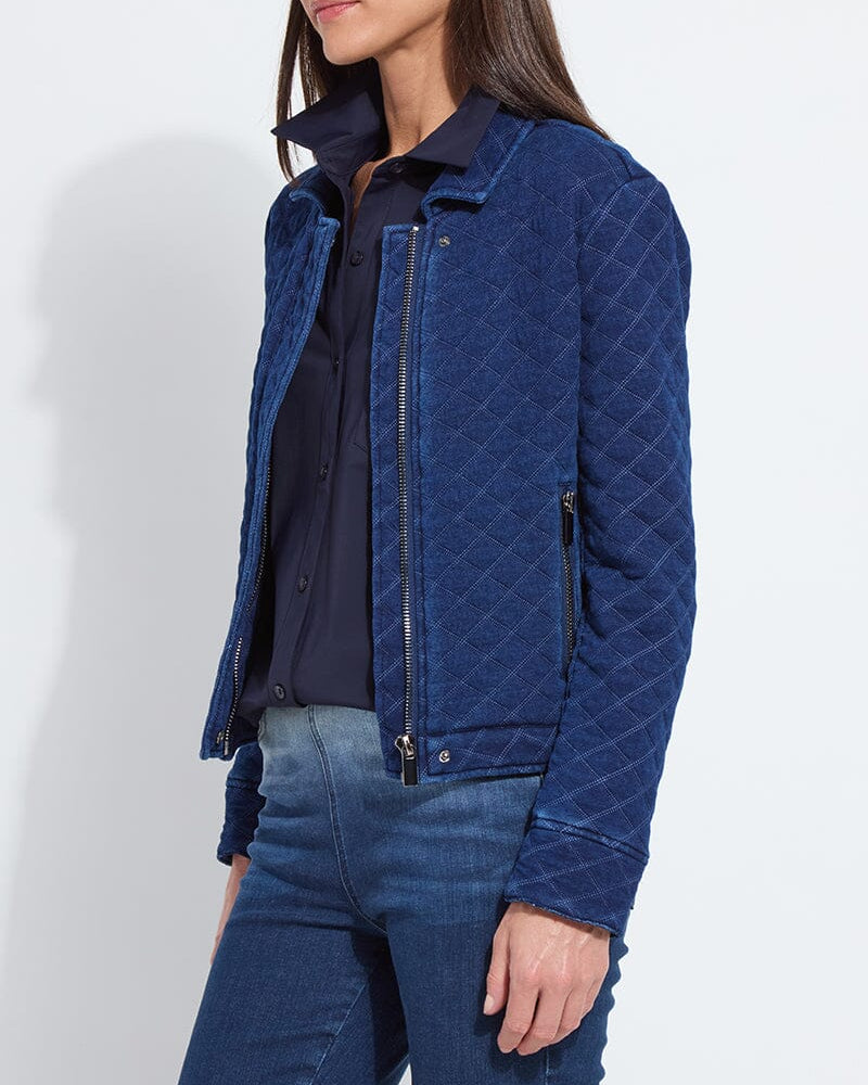 Person wearing a blue quilted jacket on a white background