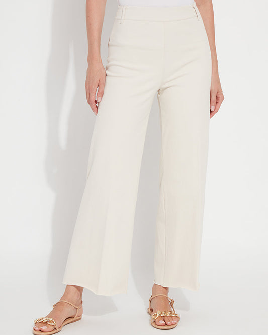 Person wearing white pants on a plain background