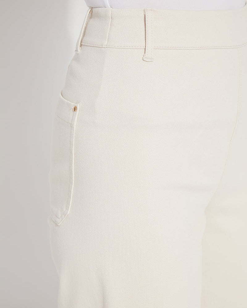 Close-up of beige pants with a white background