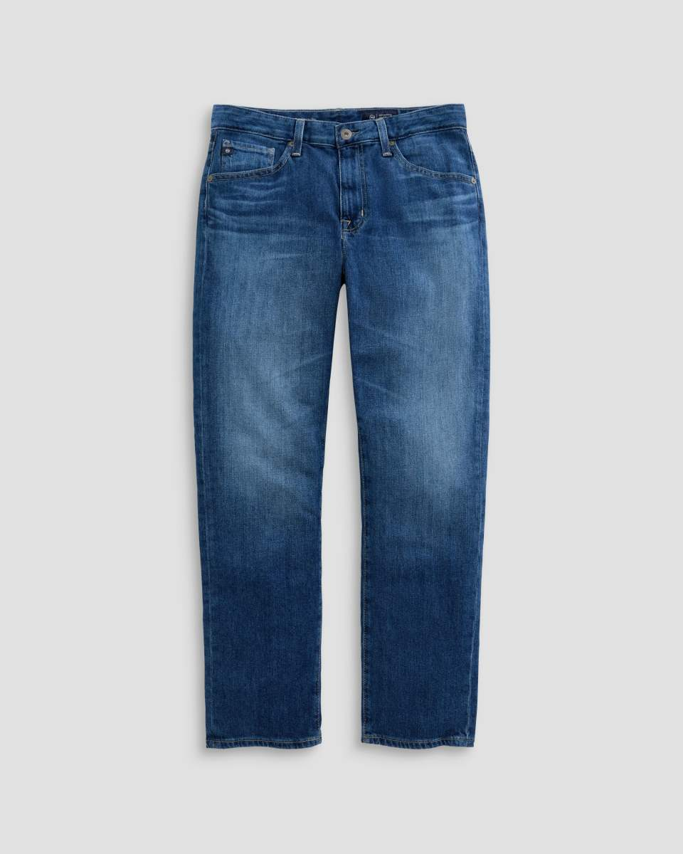 A pair of medium wash blue denim jeans with subtle fading, shown flat against a light gray background.