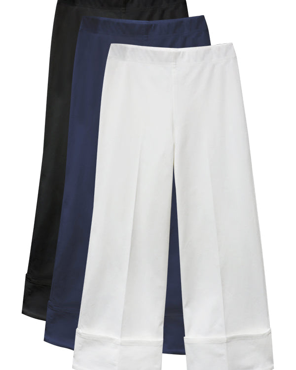 Three pairs of pants in black, blue, and white on a white background