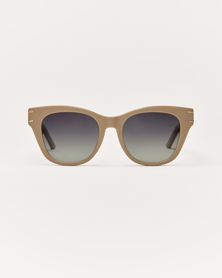 Sunglasses with a gradient lens on a light gray background