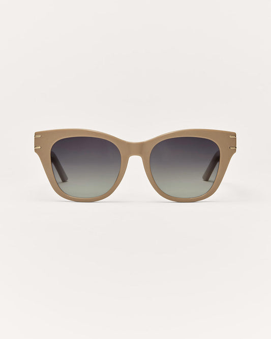 Sunglasses with a gradient lens on a light gray background