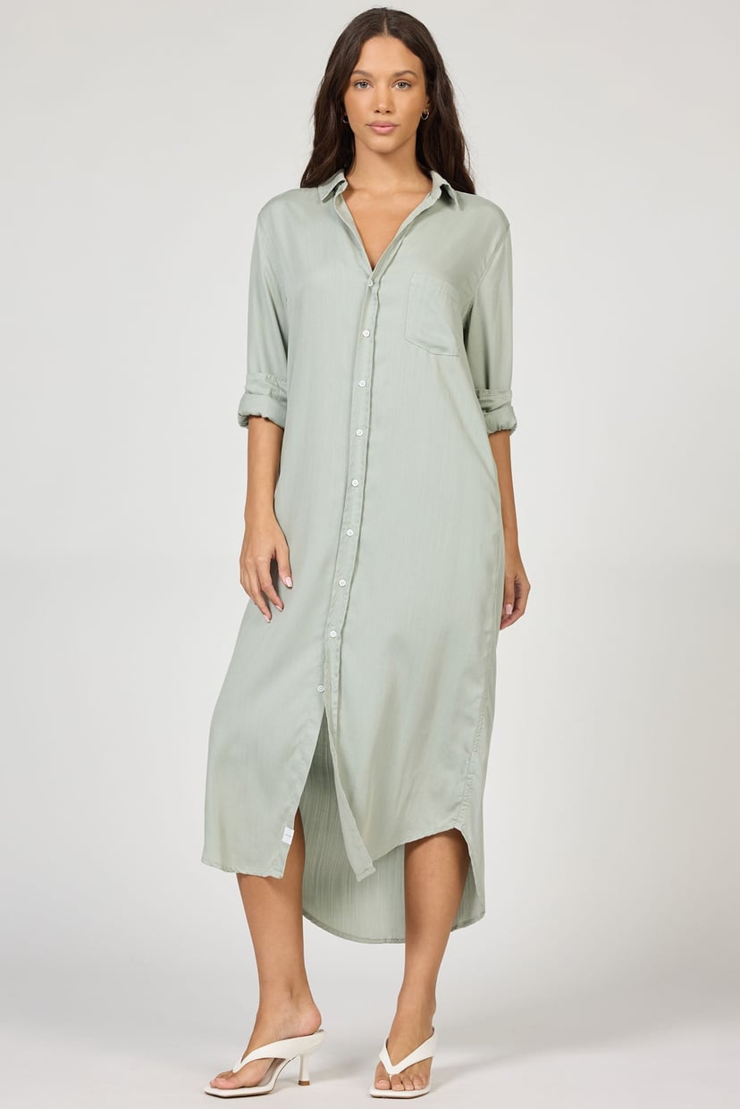 Woman wearing a light green dress on a white background
