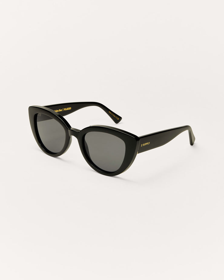 Black sunglasses with a gold logo on a white background