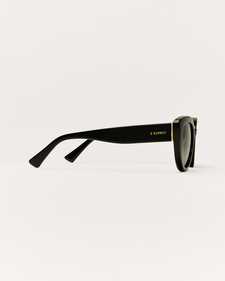 Black sunglasses with gold accents on a white background