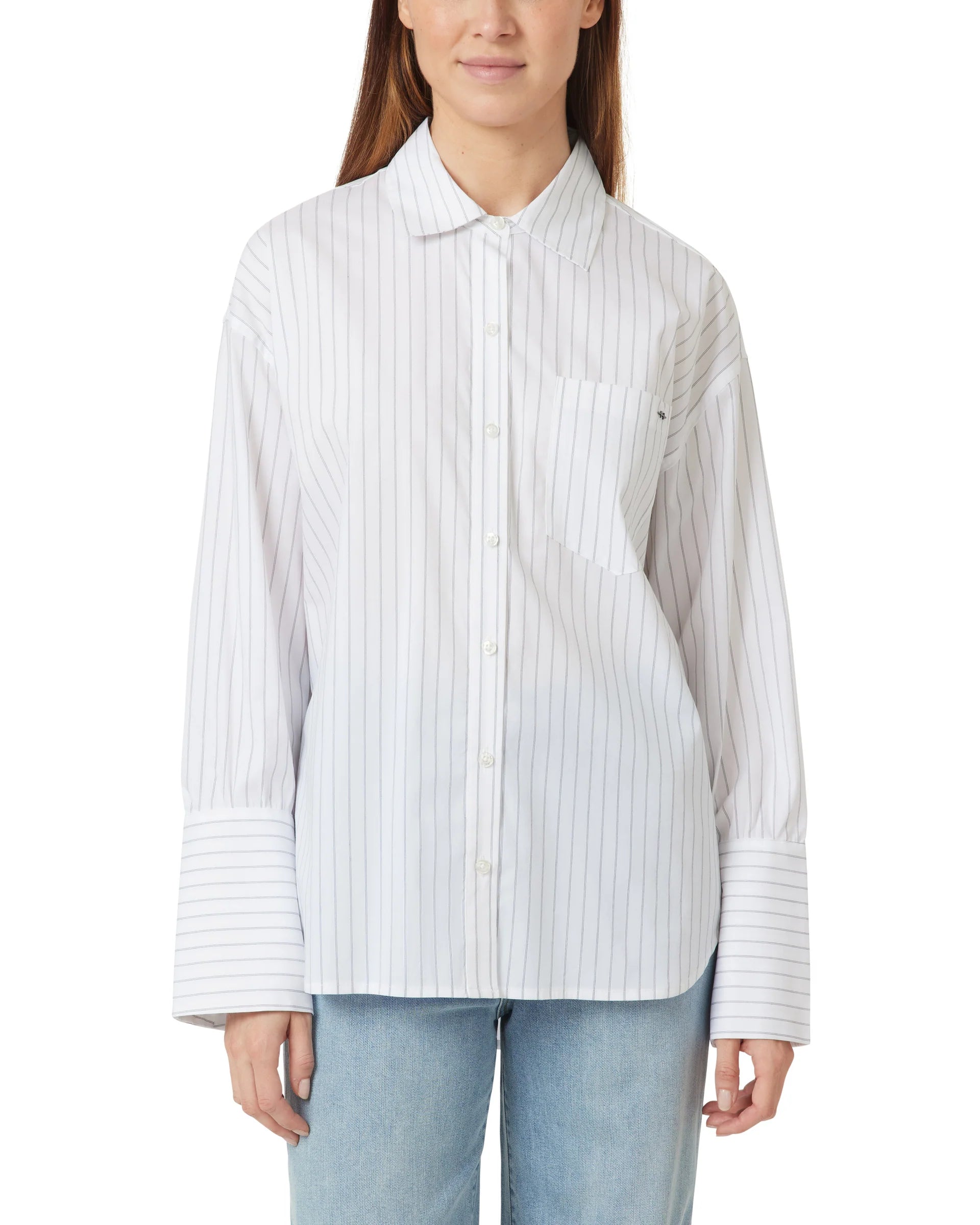Woman wearing a white and gray striped shirt on a white background