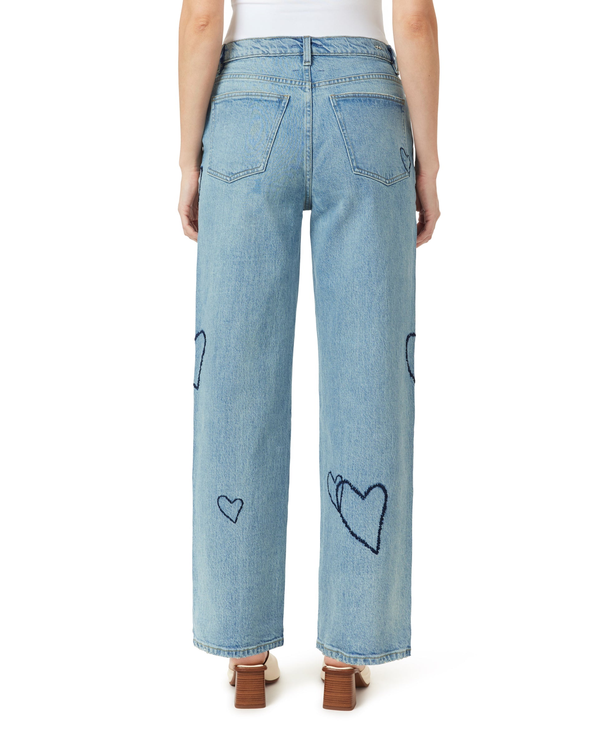 Light blue jeans with heart shapes on a white background