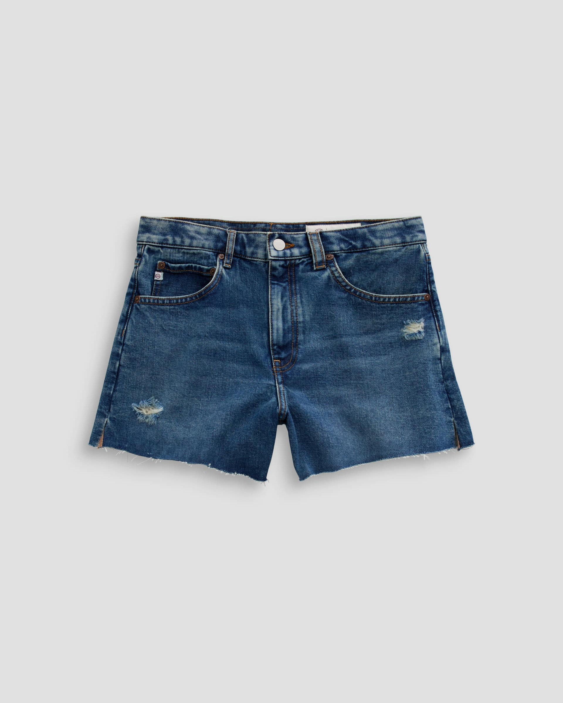 Blue denim shorts on a light gray background