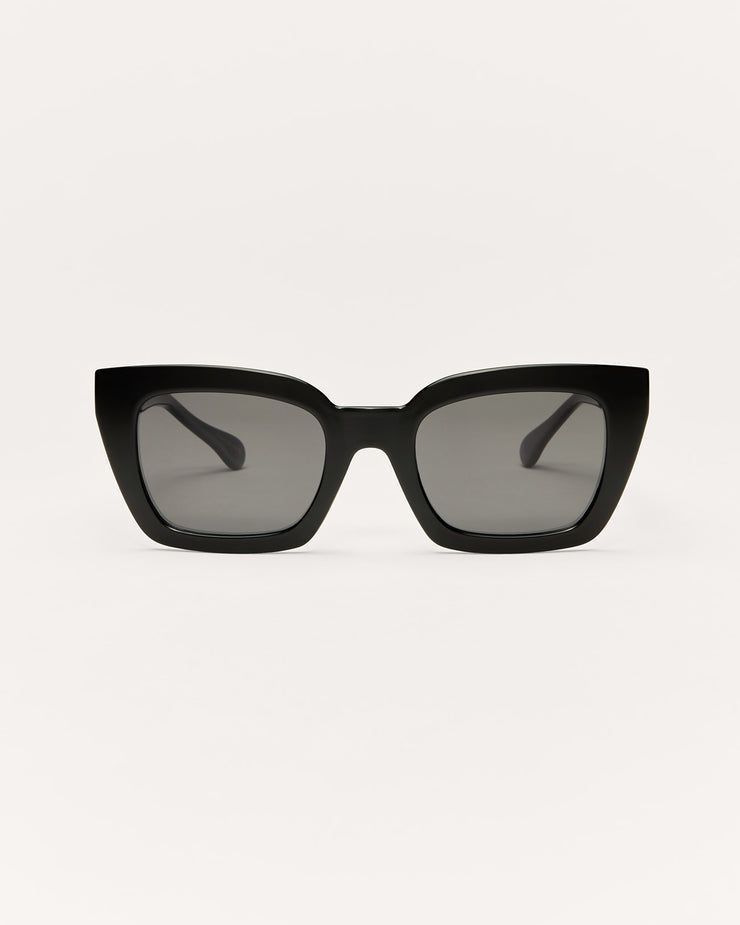 Black sunglasses with gradient lenses on a white background
