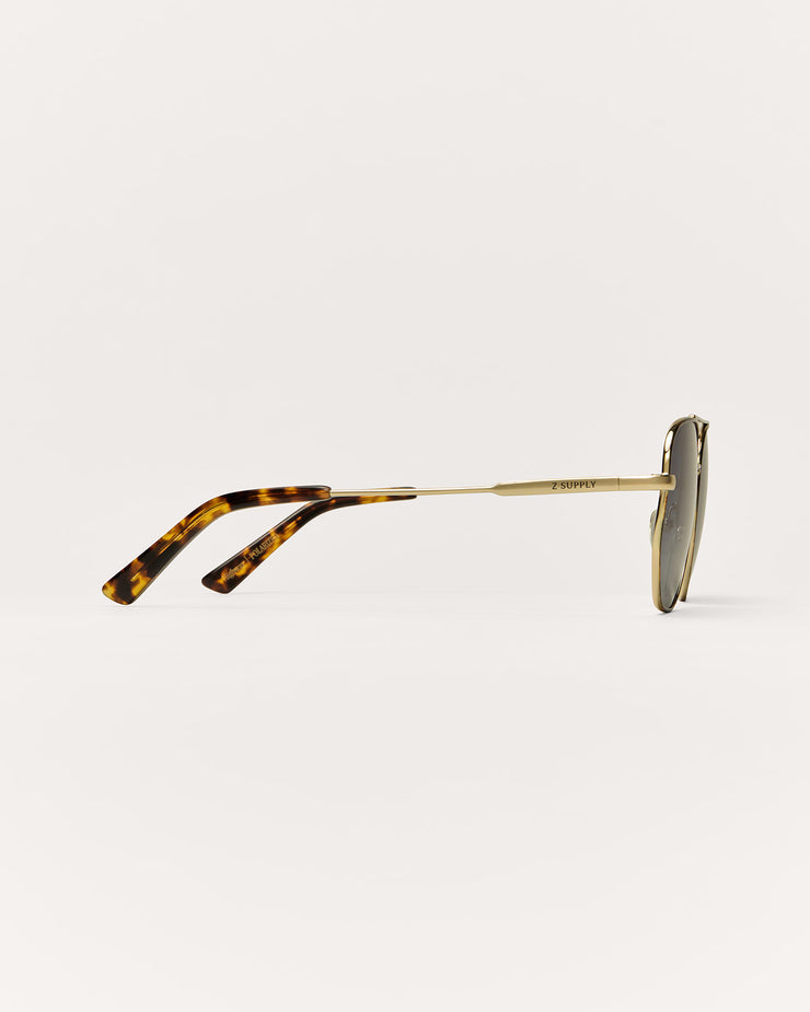 Sunglasses with tortoiseshell arms on a white background