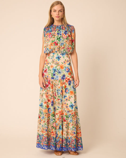 Woman wearing a floral dress on a beige background