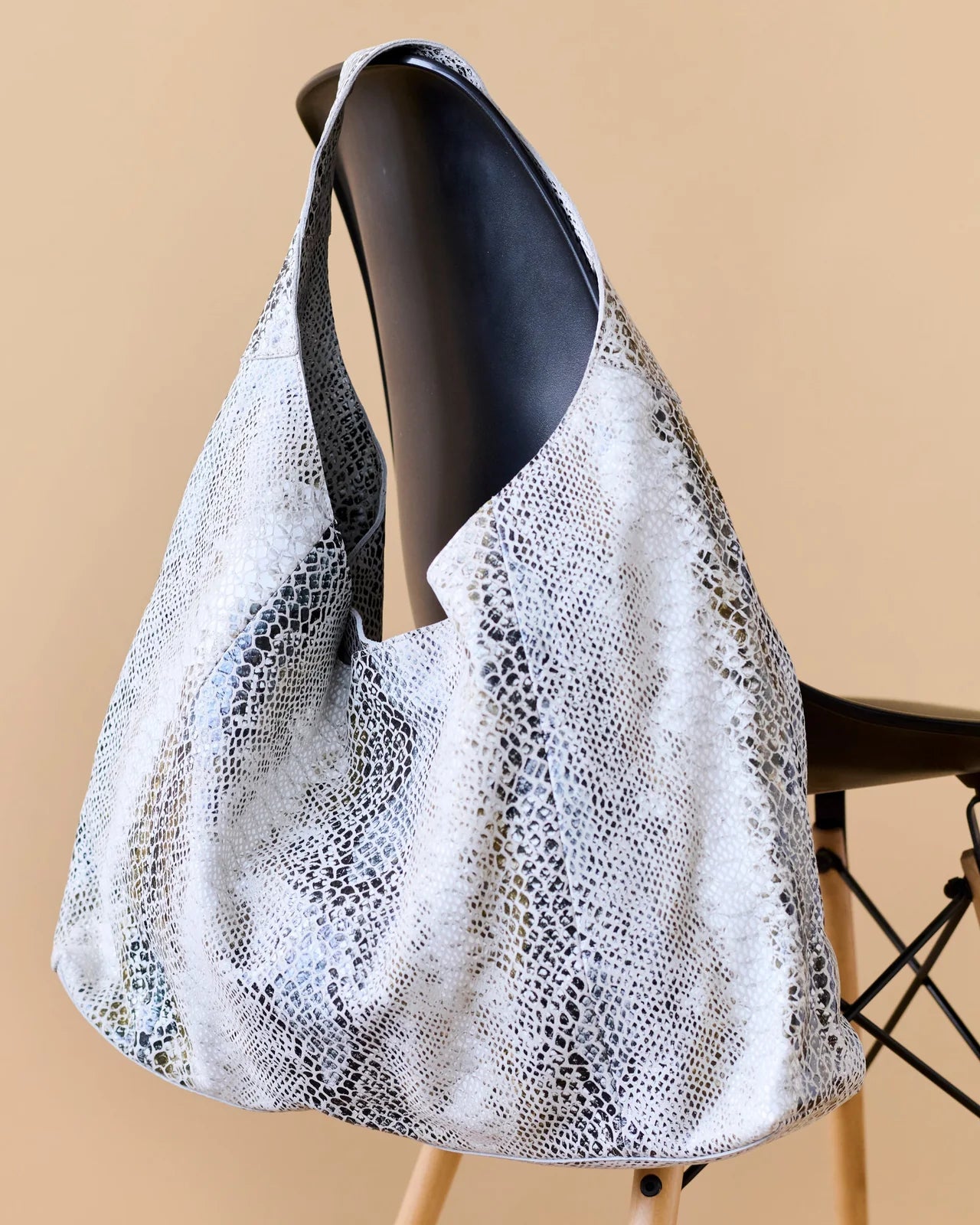 White textured handbag on a beige background