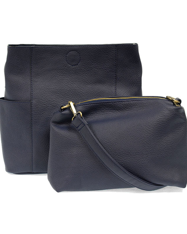 Navy vegan leather handbag with a matching pouch on a white background
