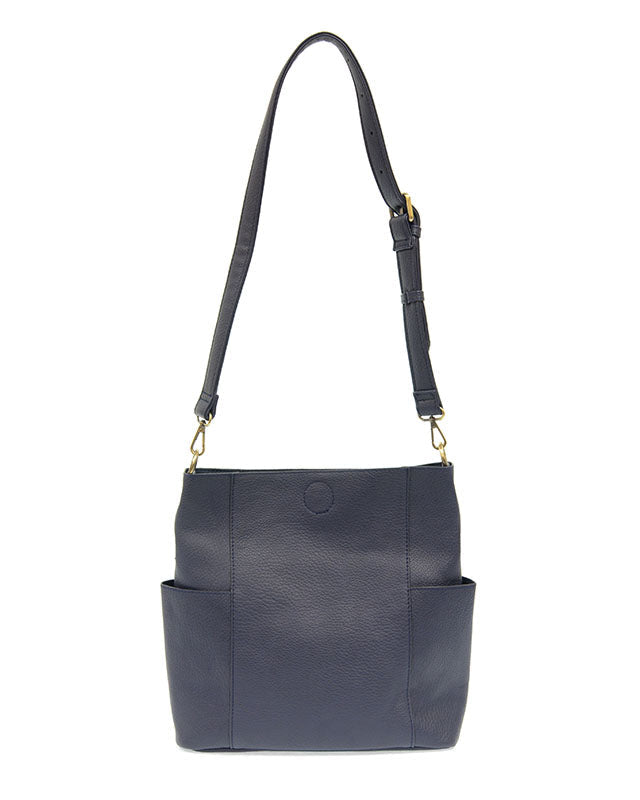 Navy vegan leather handbag with a shoulder strap on a white background