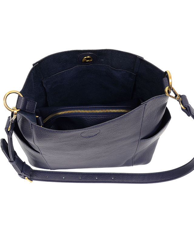 Navy vegan leather handbag with a shoulder strap on a white background