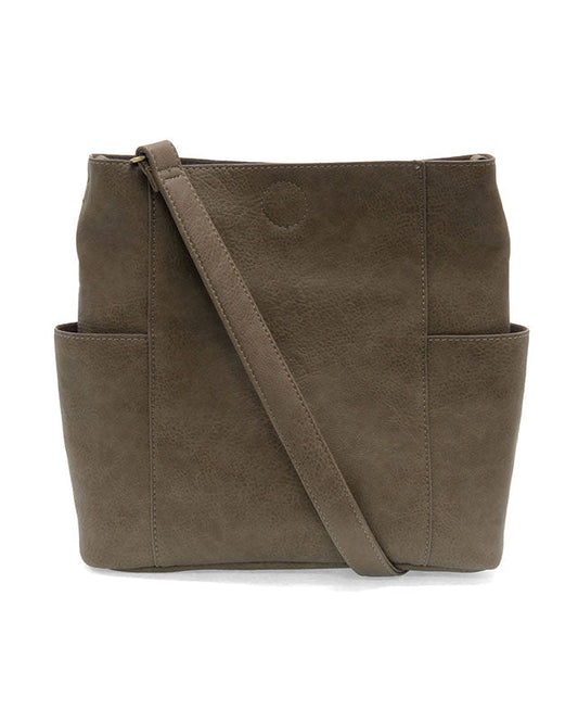 Taupe vegan leather handbag with a shoulder strap on a white background