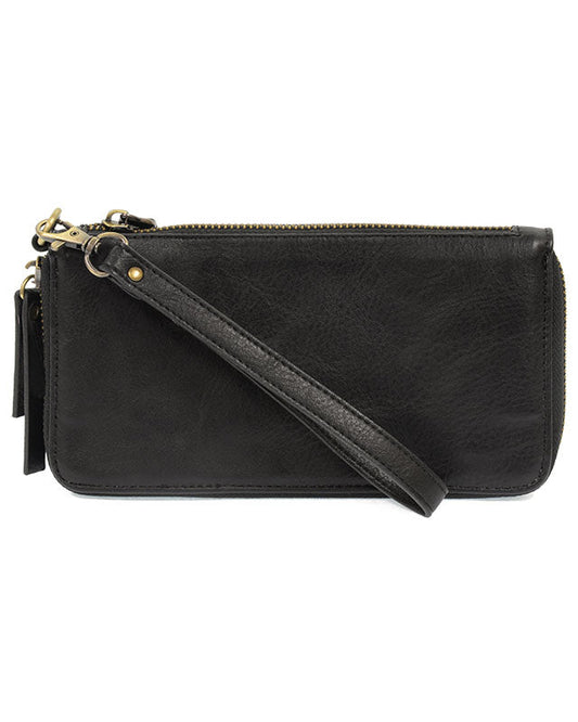 Black vegan leather wrist wallet against a white background