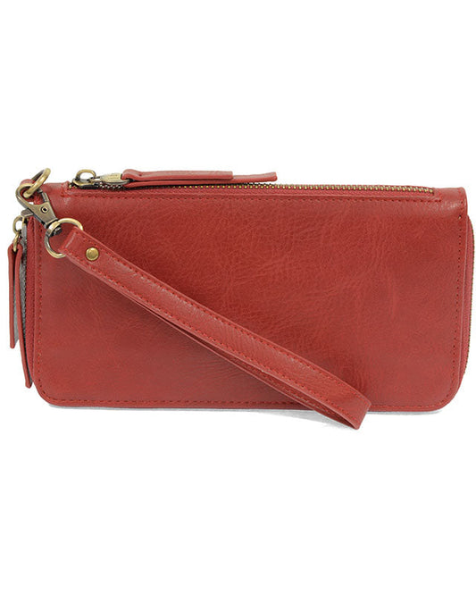 Scarlett vegan leather wallet with wrist strap against a white background.
