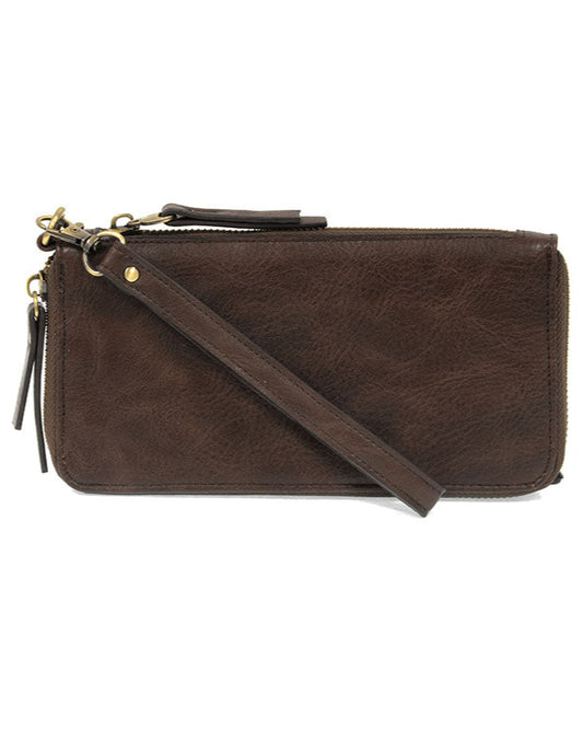 Dark oak vegan leather wallet with wrist strap against a white background.
