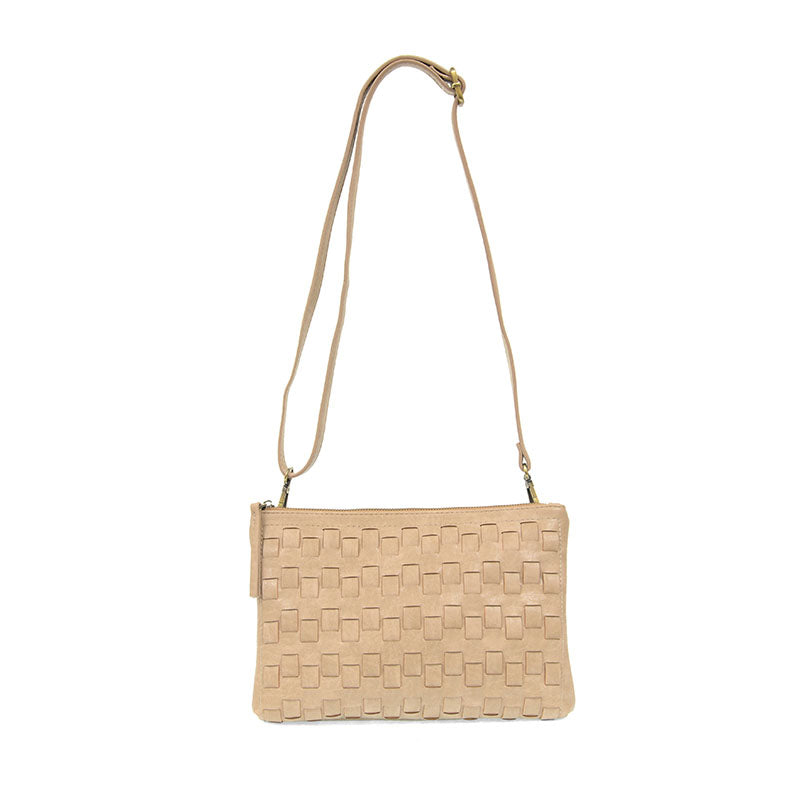 Buff woven convertible crossbody clutch with strap attached against a white background.