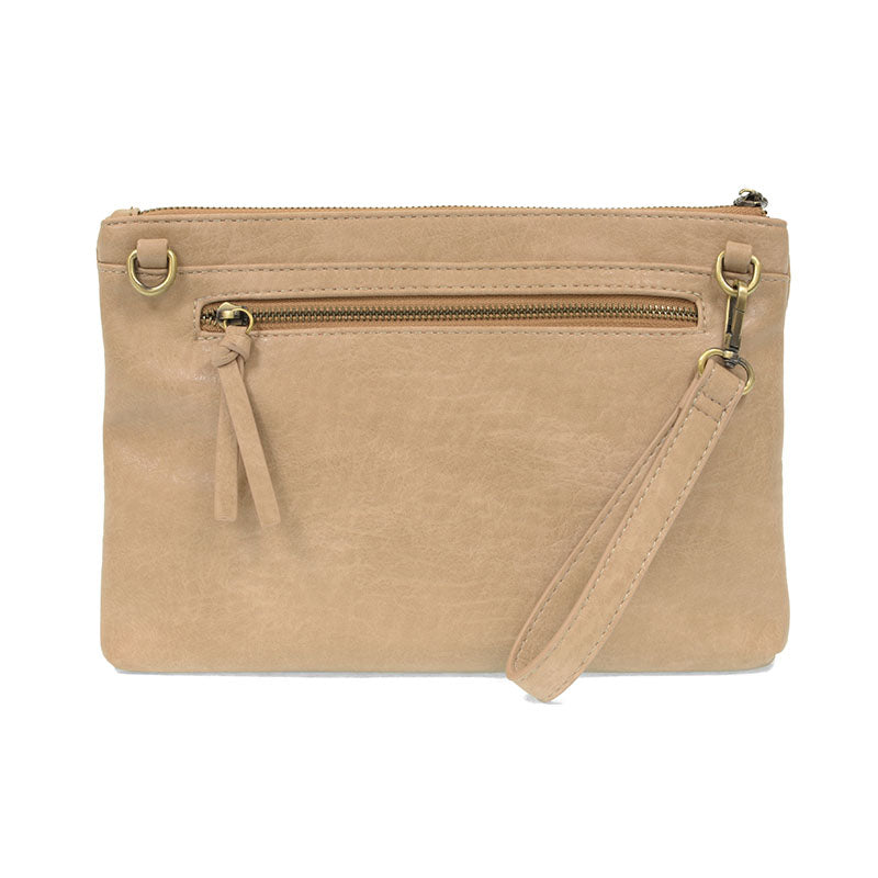 Buff woven convertible crossbody clutch against a white background.