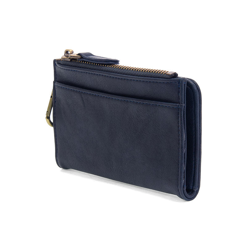 Navy vegan leather wallet with brass accents against a white background.