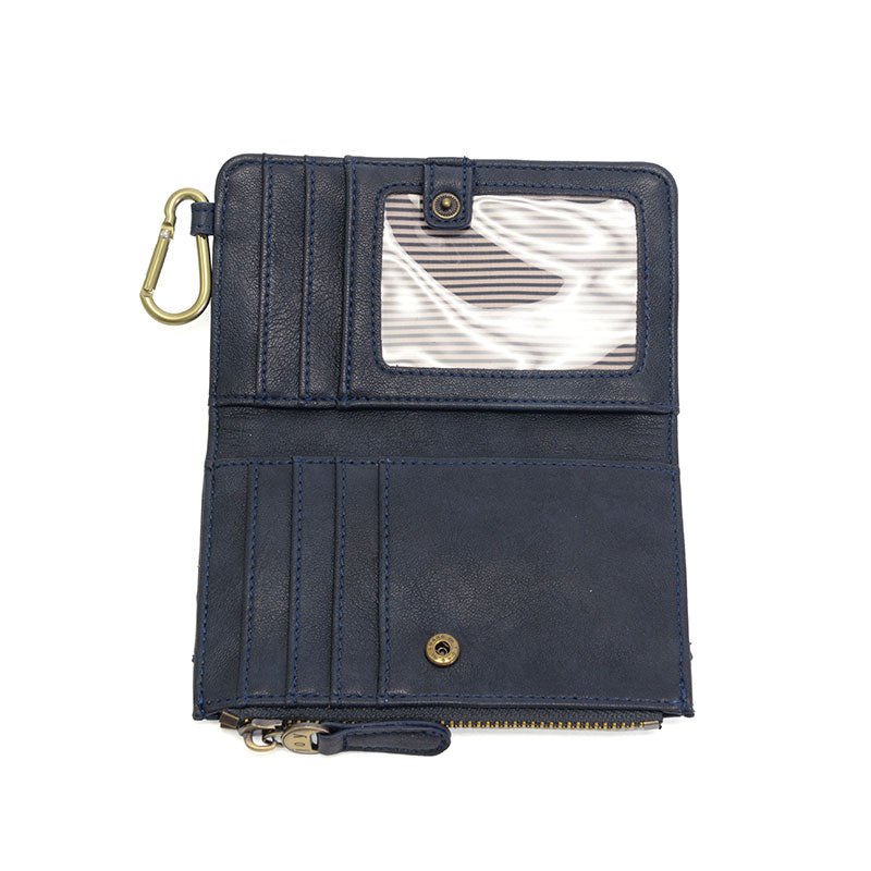 Navy vegan leather wallet with brass accents opened against a white background.