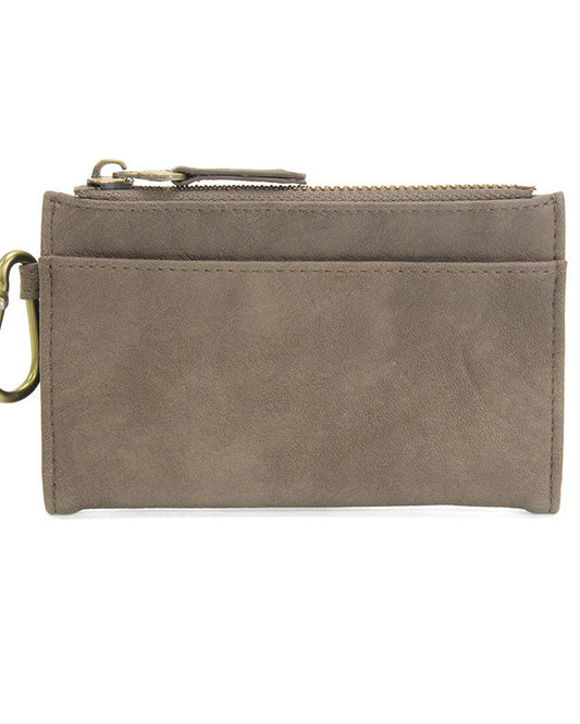 Dark taupe vegan leather wallet with brass accents against a white background.