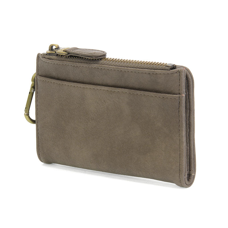 Dark taupe vegan leather wallet with brass accents against a white background.