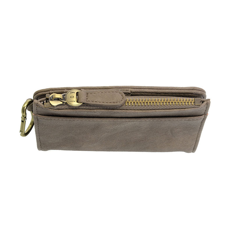Dark taupe vegan leather wallet with brass accents against a white background.