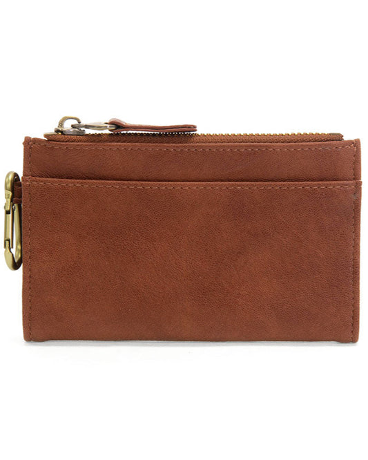 Saddle vegan leather wallet with brass accents against a white background.