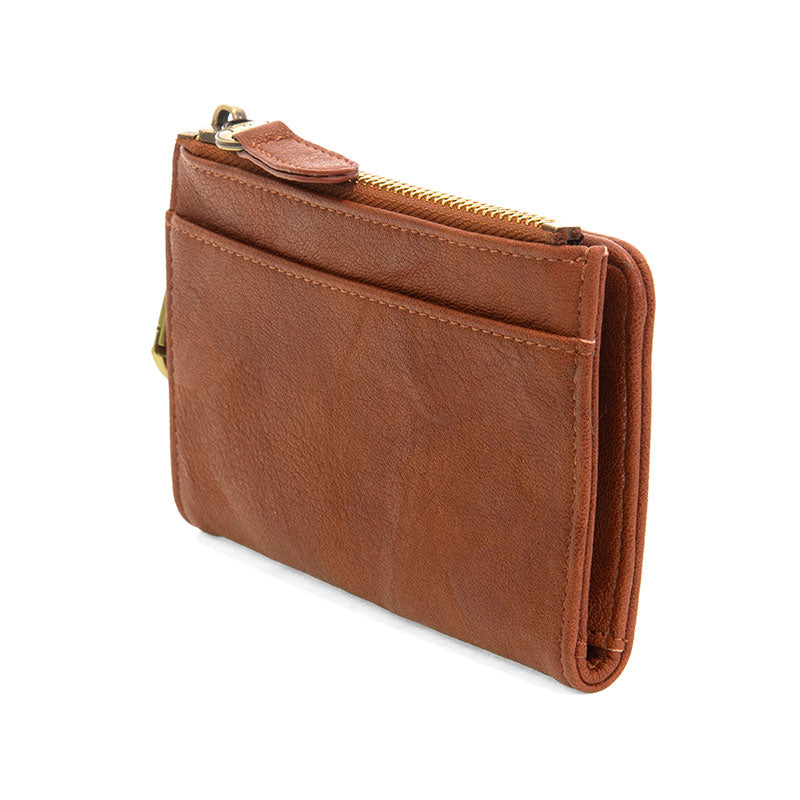 Saddle vegan leather wallet with brass accents against a white background.