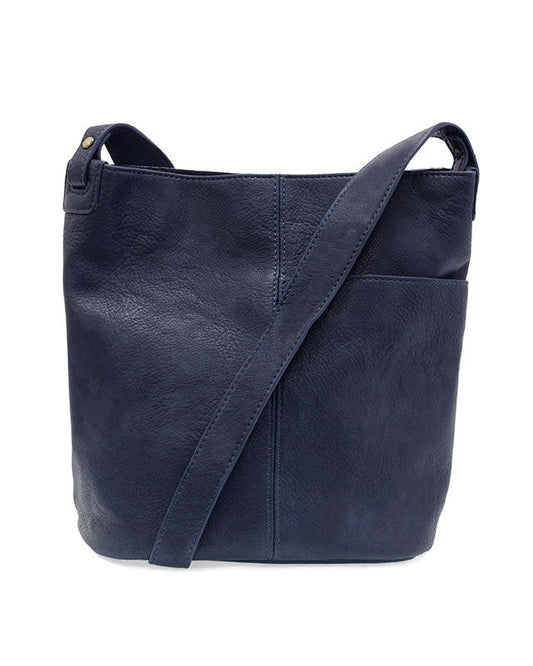 Navy vegan leather bucket handbag with gold accents against a white background.