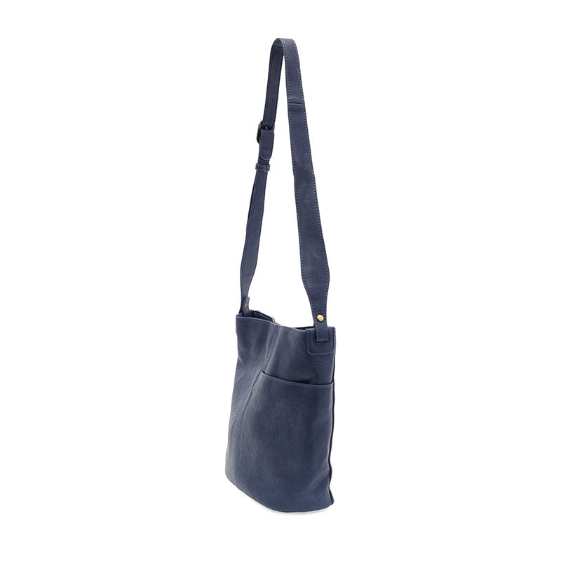 Navy vegan leather bucket handbag with gold accents against a white background.